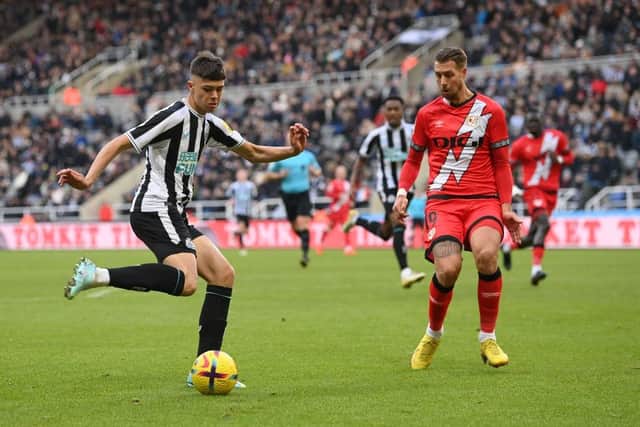 Newcastle player Lewis Miley shoots at goal despite the attentions of Rayo defender and former Newcastle defender Florian Lejeune during the friendly match between Newcastle United and Rayo Vallecano at St James' Park on December 17, 2022 in Newcastle upon Tyne, England. (Photo by Stu Forster/Getty Images)