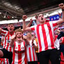 LONDON, ENGLAND - MAY 21:  Sunderland fans celebrate after winning the Sky Bet League One Play-Off trophy in the Sky Bet League One Play-Off Final match between Sunderland and Wycombe Wanderers at Wembley Stadium on May 21, 2022 in London, England. (Photo by Justin Setterfield/Getty Images)