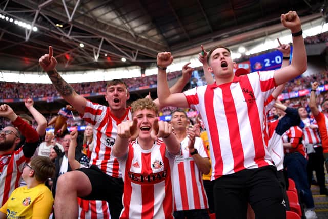 LONDON, ENGLAND - MAY 21:  Sunderland fans celebrate after winning the Sky Bet League One Play-Off trophy in the Sky Bet League One Play-Off Final match between Sunderland and Wycombe Wanderers at Wembley Stadium on May 21, 2022 in London, England. (Photo by Justin Setterfield/Getty Images)