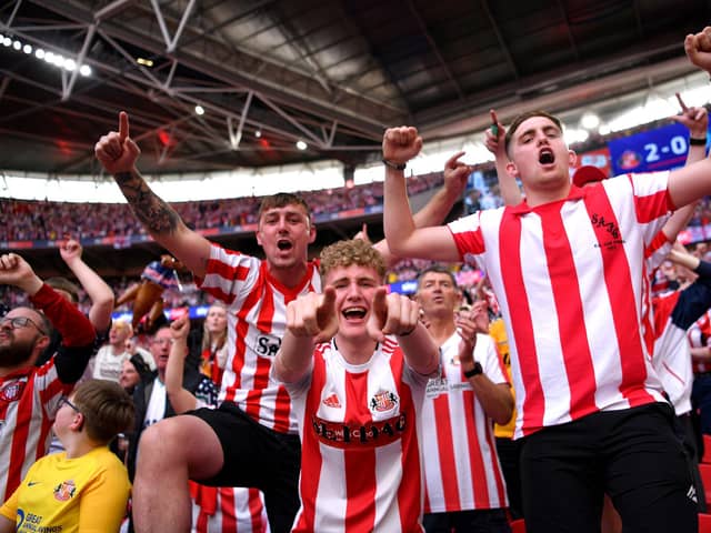 LONDON, ENGLAND - MAY 21:  Sunderland fans celebrate after winning the Sky Bet League One Play-Off trophy in the Sky Bet League One Play-Off Final match between Sunderland and Wycombe Wanderers at Wembley Stadium on May 21, 2022 in London, England. (Photo by Justin Setterfield/Getty Images)