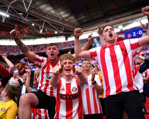 LONDON, ENGLAND - MAY 21:  Sunderland fans celebrate after winning the Sky Bet League One Play-Off trophy in the Sky Bet League One Play-Off Final match between Sunderland and Wycombe Wanderers at Wembley Stadium on May 21, 2022 in London, England. (Photo by Justin Setterfield/Getty Images)