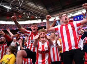 LONDON, ENGLAND - MAY 21:  Sunderland fans celebrate after winning the Sky Bet League One Play-Off trophy in the Sky Bet League One Play-Off Final match between Sunderland and Wycombe Wanderers at Wembley Stadium on May 21, 2022 in London, England. (Photo by Justin Setterfield/Getty Images)