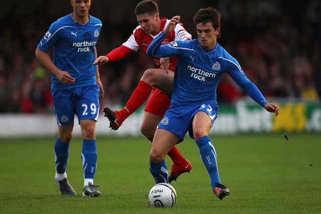 Ryan Donaldson of Newcastle United battles for the ball with Charlie Barnett of Accrington Stanley during the Carling Cup 2nd Round match between Accrington Stanley and Newcastle United at the Crown Ground on August 25, 2010 in Accrington, England.  (Photo by Alex Livesey/Getty Images)