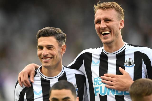 Newcastle defenders Fabian Schar (l) and Dan Burn share a joke during the Pre Season friendly match between Newcastle United and Atalanta at St James' Park on July 29, 2022 in Newcastle upon Tyne, England. (Photo by Stu Forster/Getty Images)