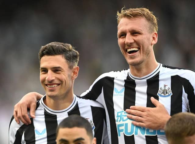 Newcastle defenders Fabian Schar (l) and Dan Burn share a joke during the Pre Season friendly match between Newcastle United and Atalanta at St James' Park on July 29, 2022 in Newcastle upon Tyne, England. (Photo by Stu Forster/Getty Images)
