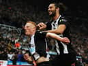 Matty Longstaff of Newcastle United celebrates with team mate Andy Carroll after he scores the only goal of the game during the Premier League match between Newcastle United and Manchester United at St. James Park on October 06, 2019 in Newcastle upon Tyne, United Kingdom.