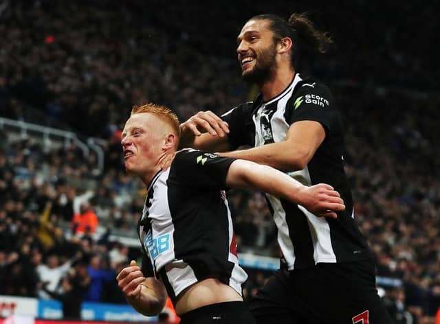 Matty Longstaff of Newcastle United celebrates with team mate Andy Carroll after he scores the only goal of the game during the Premier League match between Newcastle United and Manchester United at St. James Park on October 06, 2019 in Newcastle upon Tyne, United Kingdom.
