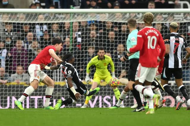 Allan Saint-Maximin of Newcastle United scores their team's first goal during the Premier League match between Newcastle United  and  Manchester United at St James' Park on December 27, 2021 in Newcastle upon Tyne, England. (Photo by Stu Forster/Getty Images)