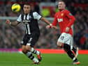 Newcastle United's English defender Danny Simpson (L) vies with Manchester United's English striker Wayne Rooney (R) during the English Premier League football match between Manchester United and Newcastle United at Old Trafford in Manchester, north-west England on November 26, 2011. AFP PHOTO/PAUL ELLIS