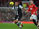 Newcastle United's English defender Danny Simpson (L) vies with Manchester United's English striker Wayne Rooney (R) during the English Premier League football match between Manchester United and Newcastle United at Old Trafford in Manchester, north-west England on November 26, 2011. AFP PHOTO/PAUL ELLIS