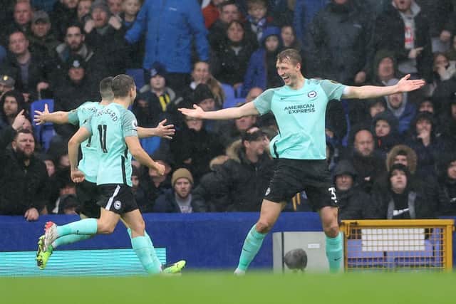 Dan Burn of Brighton & Hove Albion celebrates after scoring their side's second goal during the Premier League match between Everton  and  Brighton & Hove Albion at Goodison Park on January 02, 2022 in Liverpool, England. (Photo by Clive Brunskill/Getty Images)
