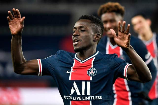 Paris Saint-Germain's Senegalese midfielder Idrissa Gueye celebrates after scoring a goal during the French L1 football match between Paris-Saint Germain (PSG) and RC Strasbourg (RCSA) at The Parc des Princes Stadium in Paris (Photo by STEPHANE DE SAKUTIN/AFP via Getty Images)