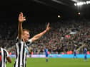 Newcastle player Dan Burn celebrates after scoring the opening goal during the Carabao Cup Quarter Final match between Newcastle United and Leicester City at St James' Park on January 10, 2023 in Newcastle upon Tyne, England. (Photo by Stu Forster/Getty Images)
