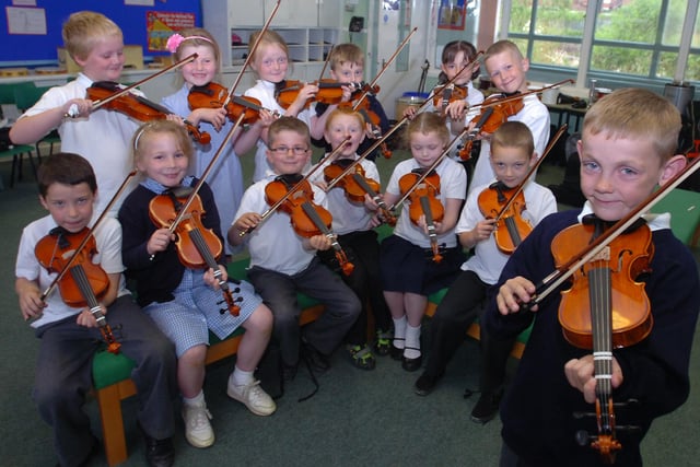 Year 2 pupils were taking violin lessons at Thorney Close Primary School in 2010. Have you spotted someone you know?