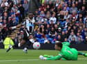 Newcastle United's Allan Saint-Maximin has a shot against Burnley's Nick Pope on the final day of last season.