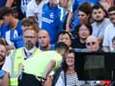Tony Harrington checks the VAR screen during a Premier League match at Brighton.  