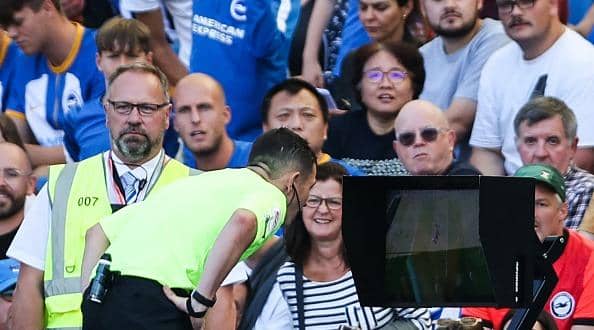 Tony Harrington checks the VAR screen during a Premier League match at Brighton.  