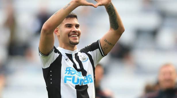 Newcastle United's Brazilian midfielder Bruno Guimaraes celebrates on the pitch after the English Premier League football match between Newcastle United and Leicester City at St James' Park in Newcastle-upon-Tyne, north east England on April 17, 2022. (Photo by LINDSEY PARNABY/AFP via Getty Images)