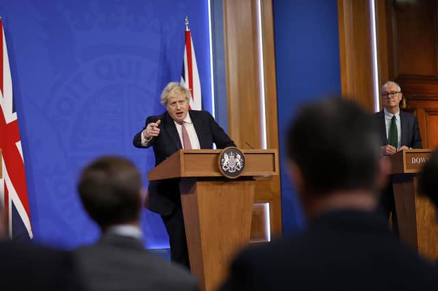 (left to right) Chief medical officer Sir Chris Whitty, Prime Minister Boris Johnson and chief scientific adviser Sir Patrick Vallance during a media briefing in Downing Street, London, to outline the Government's new long-term Covid-19 plan. Picture date: Monday February 21, 2022. PA Photo. See PA story HEALTH Coronavirus . Photo credit should read: Tolga Akmen/PA Wire