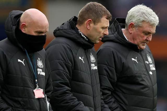 Newcastle United head coach Steve Bruce pictured alongside assistant coaches Graeme Jones and Steve Agnew. (Photo by CLIVE BRUNSKILL/POOL/AFP via Getty Images)