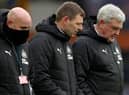 Newcastle United head coach Steve Bruce pictured alongside assistant coaches Graeme Jones and Steve Agnew. (Photo by CLIVE BRUNSKILL/POOL/AFP via Getty Images)