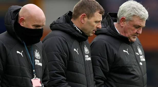 Newcastle United head coach Steve Bruce pictured alongside assistant coaches Graeme Jones and Steve Agnew. (Photo by CLIVE BRUNSKILL/POOL/AFP via Getty Images)