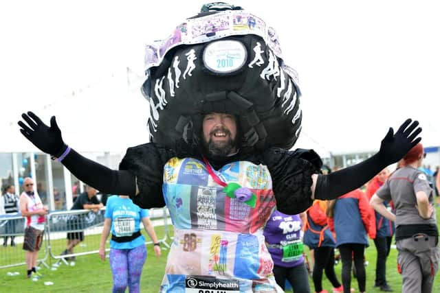 Colin Burgin-Plews, aka the Big Pink Dress, in a handcrafted creation after completing the Great North Run 2018.
