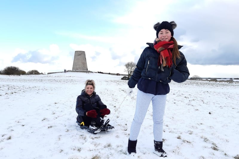 Tia Cole pulling her mam Angie Cole on a sledge on Cleadon Hills.