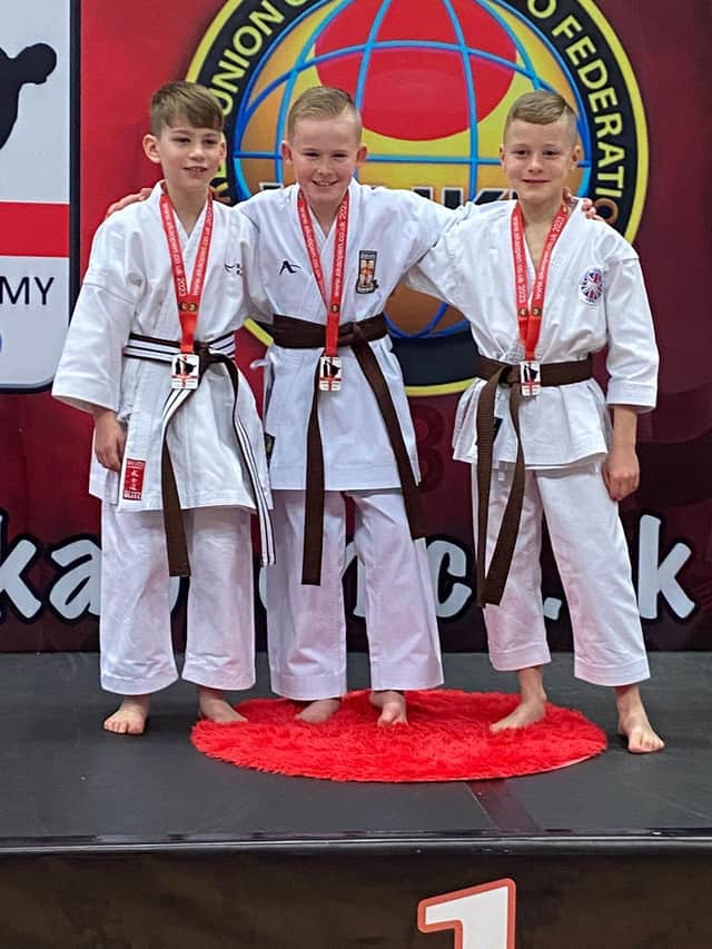 Riley Rogerson, centre, with his gold medal.