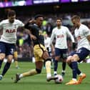 Joe Willock of Newcastle United is challenged by Ben Davies of Tottenham Hotspur during the Premier League match between Tottenham Hotspur and Newcastle United at Tottenham Hotspur Stadium on April 03, 2022 in London, England. (Photo by Ryan Pierse/Getty Images)