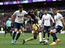 Joe Willock of Newcastle United is challenged by Ben Davies of Tottenham Hotspur during the Premier League match between Tottenham Hotspur and Newcastle United at Tottenham Hotspur Stadium on April 03, 2022 in London, England. (Photo by Ryan Pierse/Getty Images)