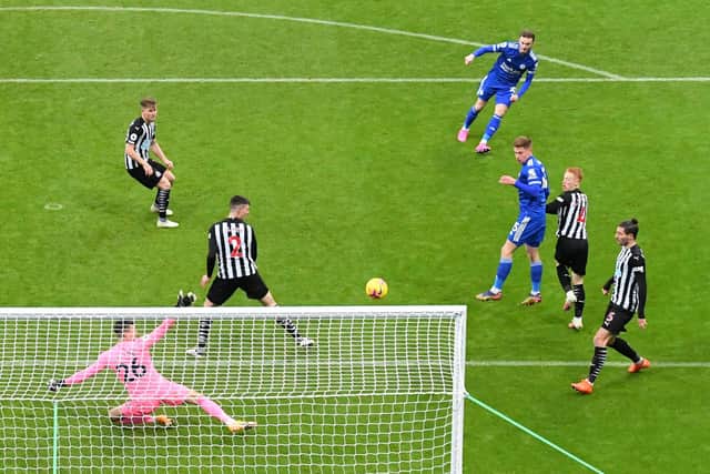 Leicester City's English midfielder James Maddison (top) shoots to score the opening goal of the English Premier League football match between Newcastle United and Leicester City at St James' Park in Newcastle-upon-Tyne, north east England on January 3, 2021. - Leicester won the game 2-1.