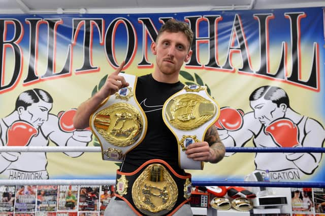 Jarrow boxer Robbie Colman shows off his three belts.