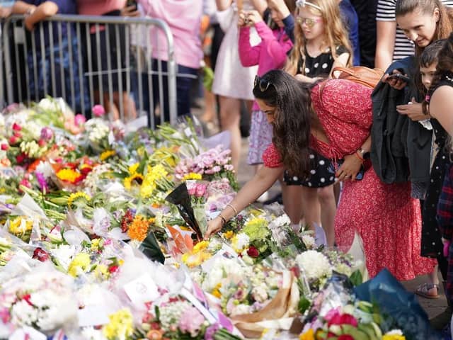 Floral tributes laid at the gates of Windsor Castle in Berkshire, following the death of Queen Elizabeth II.