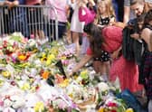 Floral tributes laid at the gates of Windsor Castle in Berkshire, following the death of Queen Elizabeth II.