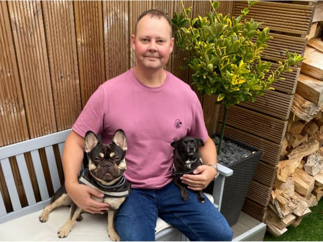 Mark Turbitt with pet dogs Woody (left) and Jessie.