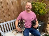 Mark Turbitt with pet dogs Woody (left) and Jessie.