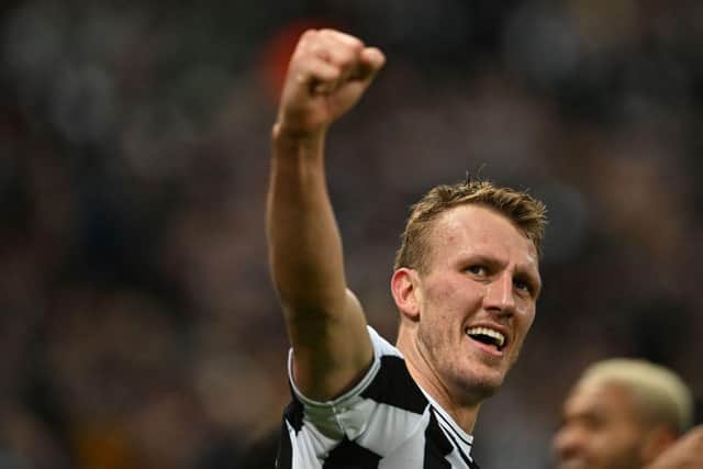 Newcastle United's English defender Dan Burn celebrates after scoring the opening goal of the English League Cup quarter final football match between Newcastle United and Leicester City at St James' Park in Newcastle upon Tyne in north-east England on January 10, 2023. (Photo by PAUL ELLIS/AFP via Getty Images)