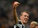 Newcastle United's English defender Dan Burn celebrates after scoring the opening goal of the English League Cup quarter final football match between Newcastle United and Leicester City at St James' Park in Newcastle upon Tyne in north-east England on January 10, 2023. (Photo by PAUL ELLIS/AFP via Getty Images)