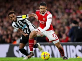 Newcastle United's Joe Willock challenges Arsenal's William Saliba.