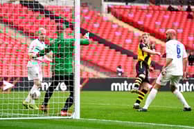 Hebburn Town's Thomas Potter (centre) shoots towards goal during the Buildbase FA Vase 2019/20 Final at Wembley Stadium, London. PA.