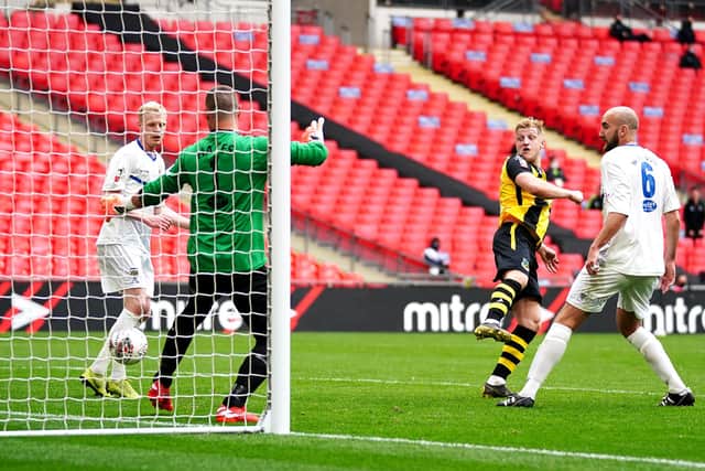Hebburn Town's Thomas Potter (centre) shoots towards goal during the Buildbase FA Vase 2019/20 Final at Wembley Stadium, London. PA.
