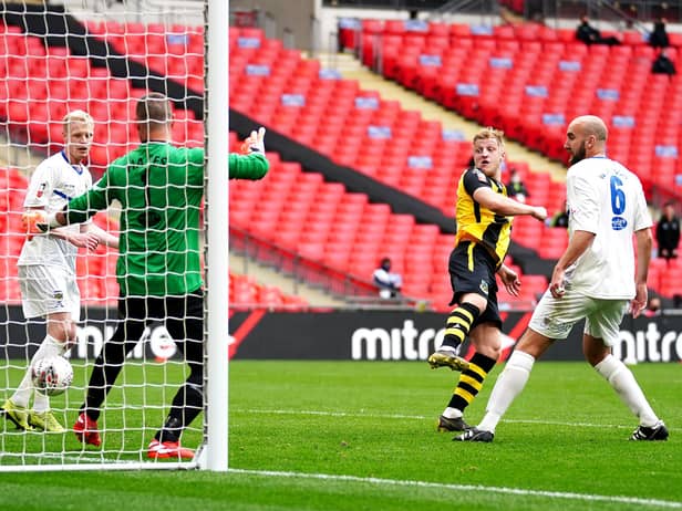 Hebburn Town's Thomas Potter (centre) shoots towards goal during the Buildbase FA Vase 2019/20 Final at Wembley Stadium, London. PA.