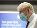 Prime Minister Boris Johnson during a visit to a vaccination hub in the Guttman Centre at Stoke Mandeville Stadium in Aylesbury, Buckinghamshire, as the booster vaccination programme continues. Picture date: Monday January 3, 2022.