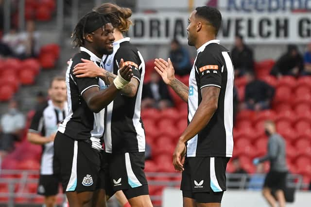 Newcastle's Callum Wilson celebrates his goal with Allan Saint-Maximin. Picture: Andrew Roe/AHPIX LTD