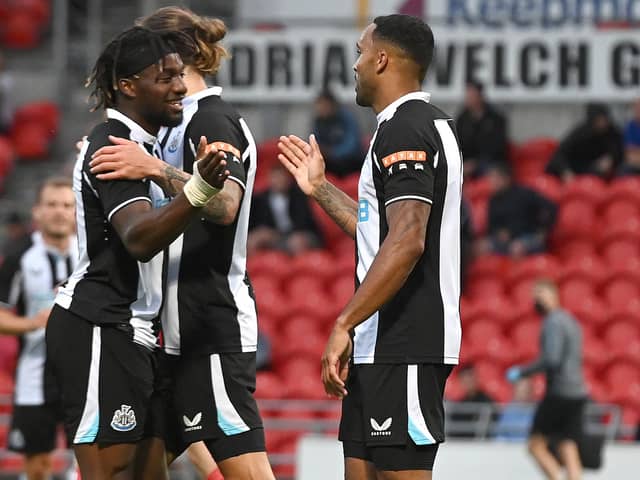 Newcastle's Callum Wilson celebrates his goal with Allan Saint-Maximin. Picture: Andrew Roe/AHPIX LTD