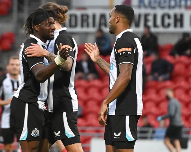 Newcastle's Callum Wilson celebrates his goal with Allan Saint-Maximin. Picture: Andrew Roe/AHPIX LTD