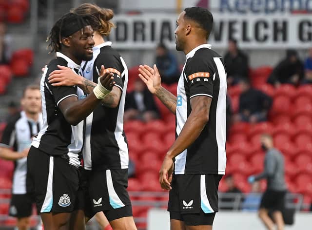 Newcastle's Callum Wilson celebrates his goal with Allan Saint-Maximin. Picture: Andrew Roe/AHPIX LTD