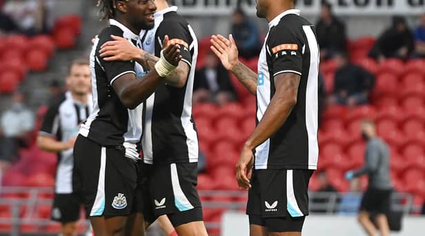 Newcastle's Callum Wilson celebrates his goal with Allan Saint-Maximin. Picture: Andrew Roe/AHPIX LTD