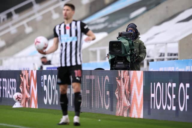 A TV cameraman films during the Premier League match between Newcastle United and Everton at St James's Park.